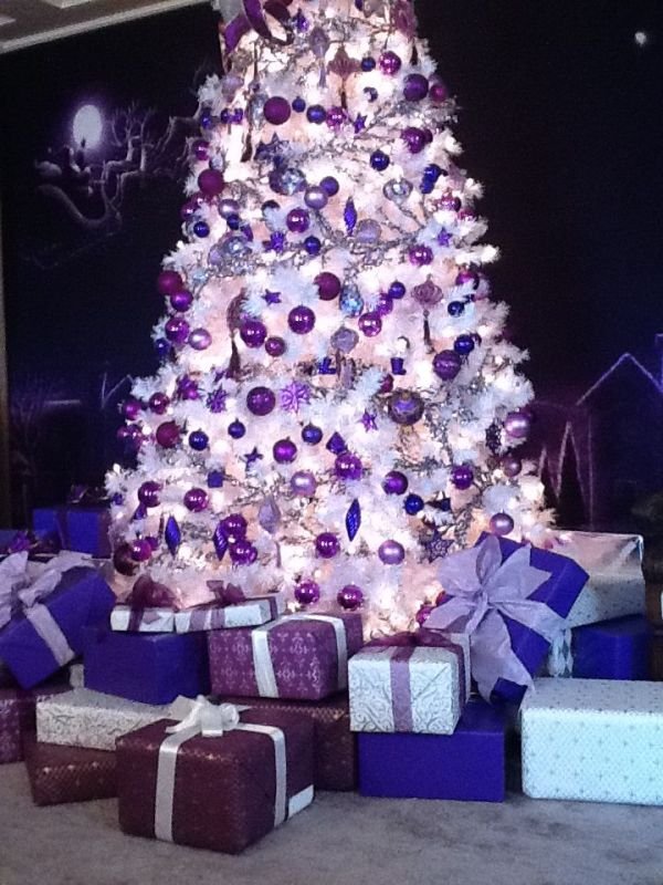 white-christmas-tree-with-purple-decorations